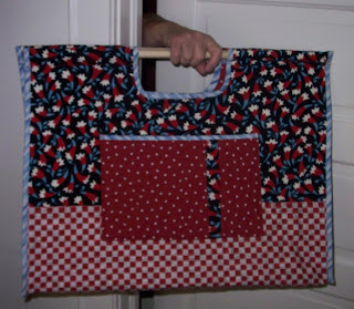 large carry all tote with wooden dowel handles made with ugly fabric for our guild challenge