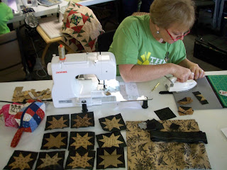 Connie working on her little star blocks using Jo Morton fabrics