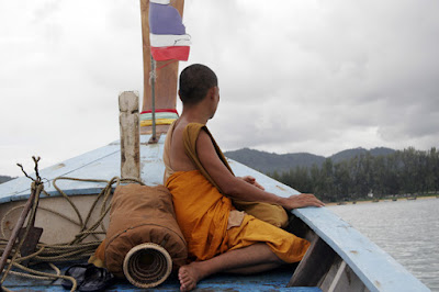 Monk on longtail boat near Rawai Beach, Phuket