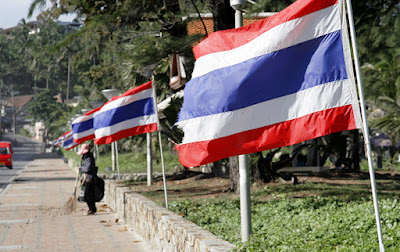 Thai flags blowing in the wind at Karon Beach