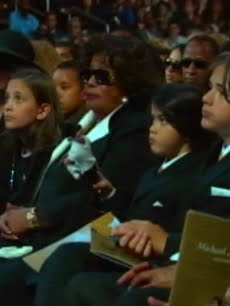 [97713_paris-katherine-prince-michael-ii-also-known-as-blanket-and-prince-michael-i-at-the-michael-jackson-public-memorial-at-staples-center-july-7-2009.jpg]
