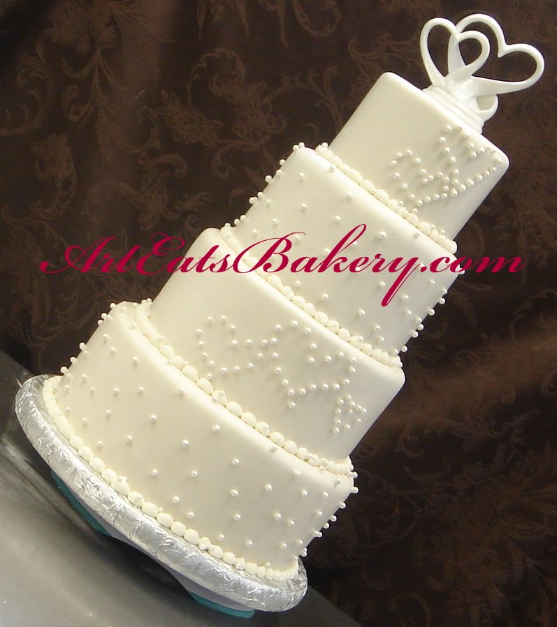 Four tier fondant wedding cake with chocolate brown dark and light pink 