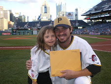 Chloe presents citations to Andy LaRoche for his outreach to children with Down syndrome