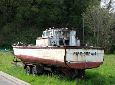 Pipe Dream II - A boat by the side of the road
