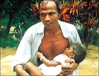 Man Breastfeeding Baby