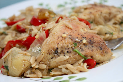 plate with chicken, artichokes, and orzo