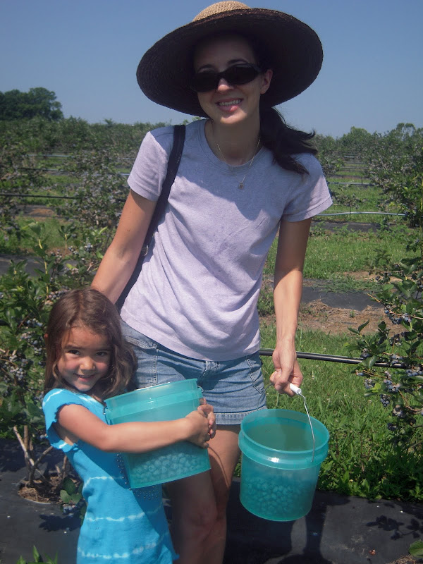 picking berries with daughter