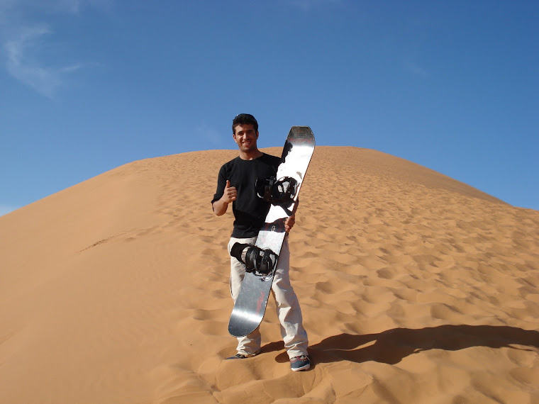 Me sandboarding on the top of dunes!!!