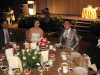 An image of wedding couple Junn and Vanessa at their main table