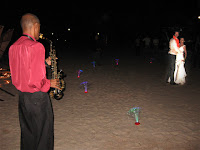 The saxophonist serenading Yen and Matt by the beach