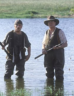 'Puter and Volgi in costume watching another saleman approach