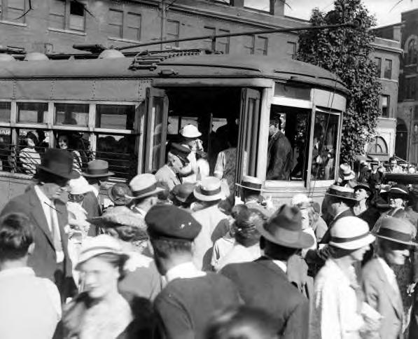 Crowd getting on a streetcar. Asheville, NC. 1928