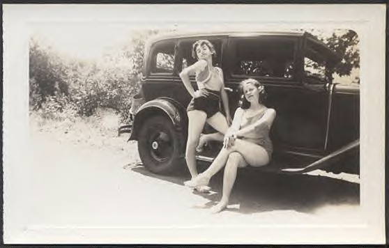 Two young ladies coming from prayer meeting. 1930 Chevrolet sedan