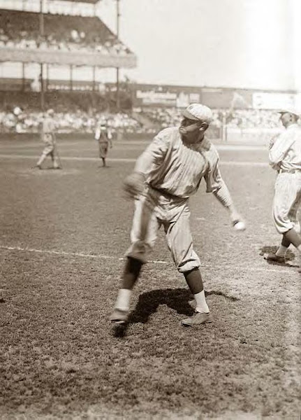 Babe Ruth throwing to baseman