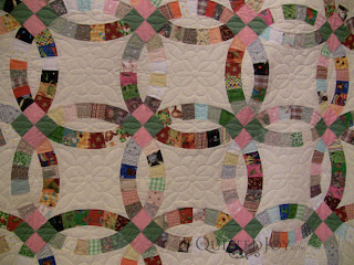 Scrappy Double Wedding Right quilt on the APQS Millie Frame - QuiltedJoy.com