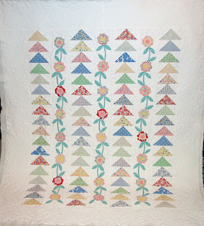 Flying Geese Garden with custom quilting by Angela Huffman - QuiltedJoy.com