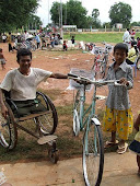 Father Smiles at son's new Rotary Bike