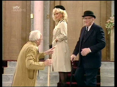 Trenchcoated Candy Davis In Are You Being Served Circa