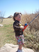 Reeling in a fish....very serious about it