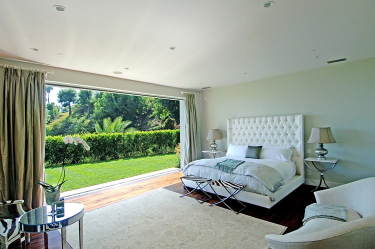 [hillcrest+master+bedroom+white+bed+tufted+headboard+zebra+print+x+benches+stools+huge+window+garden+view.jpg]