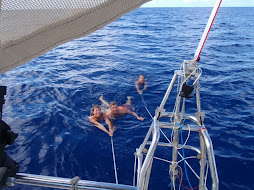 Swimming behind the boat on the crossing