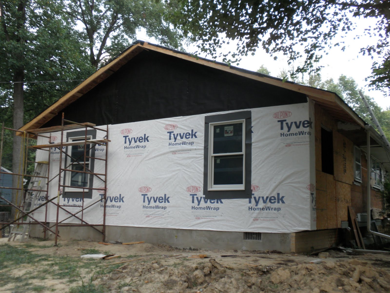 Rearranging the Walls Tar paper, Tyvec, and two windows!
