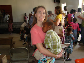 Libby holding Charlito in Haiti