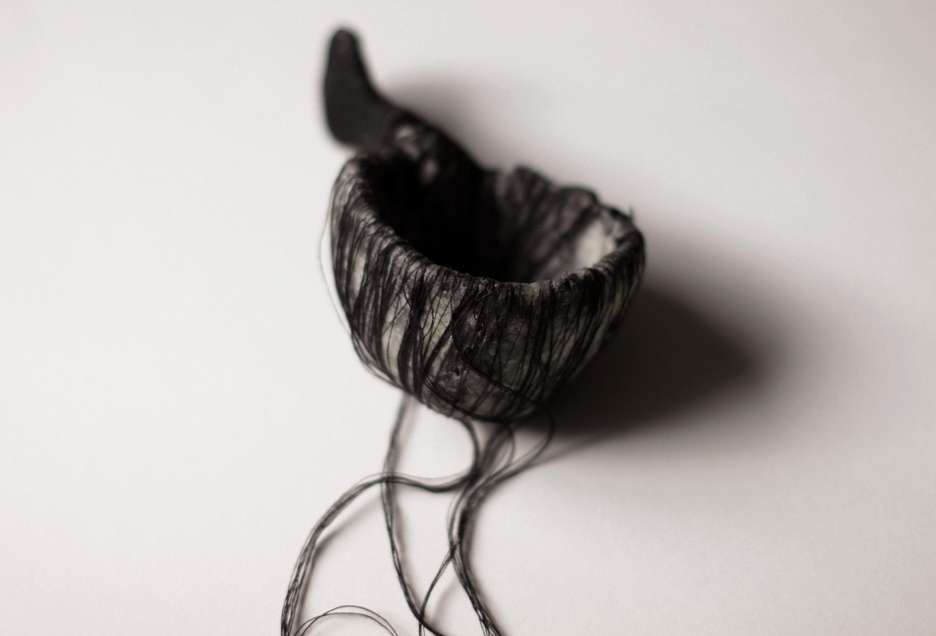 The Black Spoon, 2008. thread, hair, wax, paper & wire.