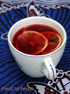 Step-by-step photos showing the process of making Zobo tea, from rinsing the flowers to straining the mixture.