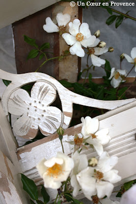 Scene of delicate flowers in carved wood