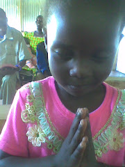 Mercy Ngetich prays during Sunday school