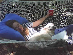 Rae and Falcor relaxing & taking in a good book & iced water!