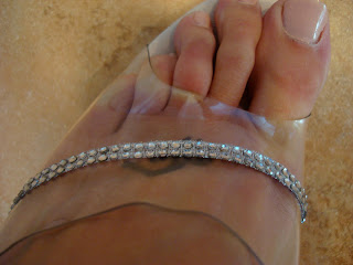 Clear portion with rhinestones on foot