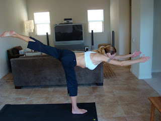 Woman doing Warrior 3 yoga pose