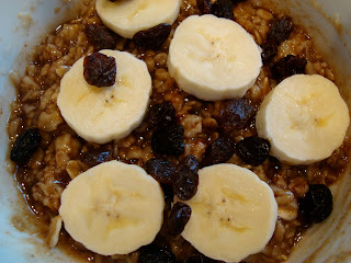 Oatmeal topped with bananas and raisins
