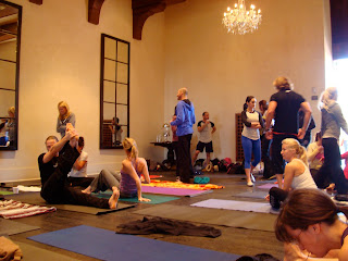 Ballroom full of people on yoga mats