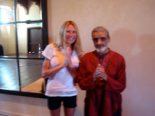 Woman standing next to Dharma Mittra