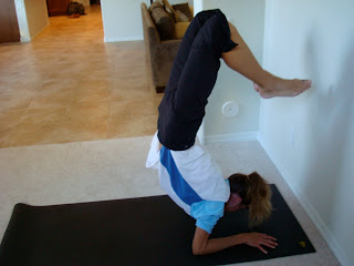 Woman doing  Scorpion yoga pose