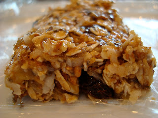 End of Vegan No-Bake Peanut Butter Chocolate Chip Protein Bar showing oats and coconut