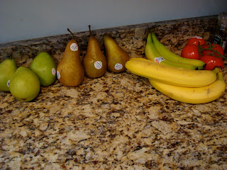 Pears, Bananas, Tomatoes on countertop