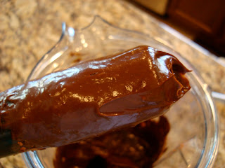 Blended Raw Vegan Chocolate Mousse with tamper showing consistency