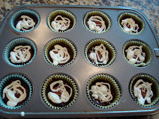 PB Cup Brownie Cupcakes with White Chocolate Icing in muffin tin