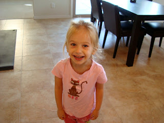 Young girl in pink smiling