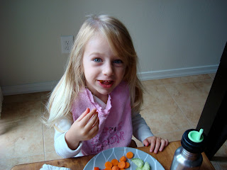 Young girl eating off plate