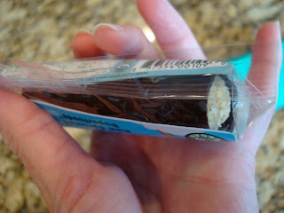 Hand holding Coco Joy Bar - 61