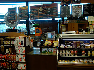 Coffee shop portion of store showing checkout and menus