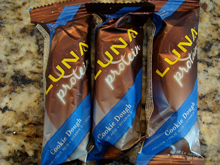 Three Luna Protein bars on countertop