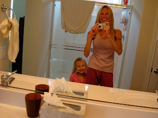 Woman and child in mirror wearing new yoga gear