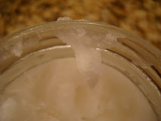 Close up of consistency of coconut oil in jar
