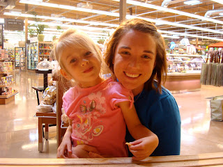 Woman smiling with young girl on lap - 11